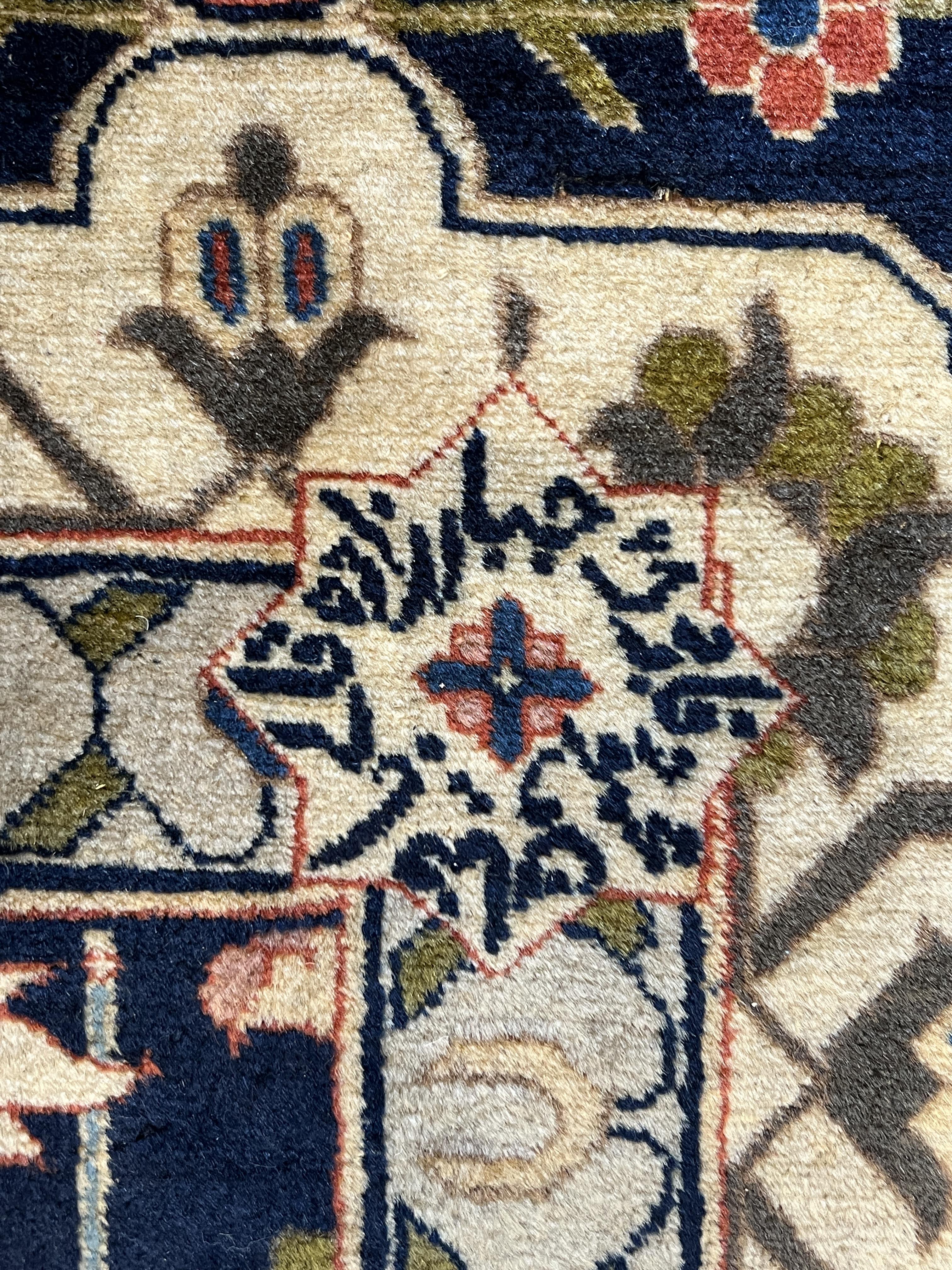 An early 20th century Benlian Tabriz carpet, signed Mahmud, 320 x 225cm